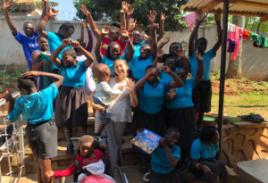 Delaney with her community at the Amaanyi Center